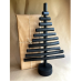 Handmade fire-burnt wood in black Xmas tree