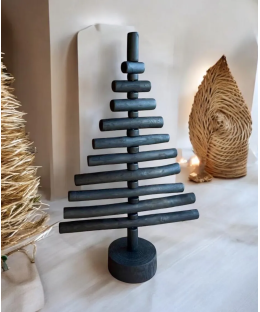 Handmade fire-burnt wood in black Xmas tree