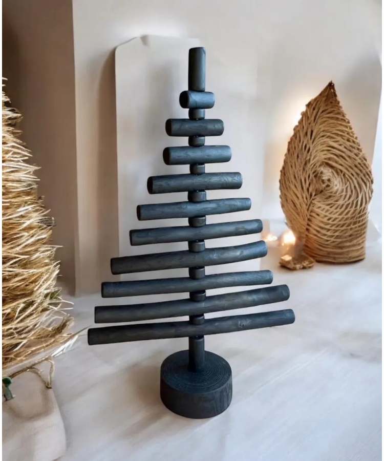 Handmade fire-burnt wood in black Xmas tree